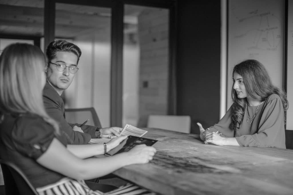 Colleagues overhear recruiter lies.